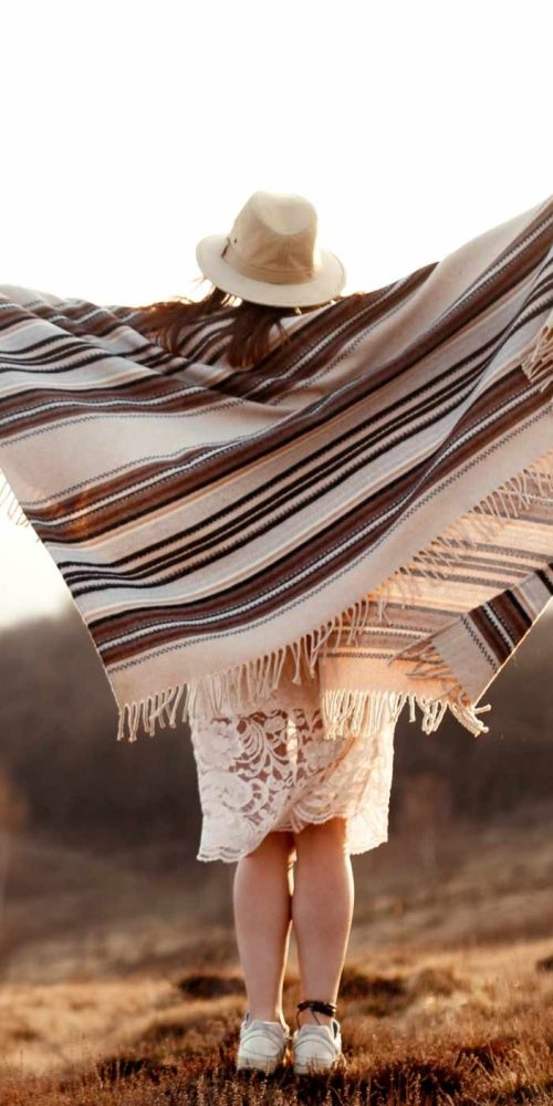 beautiful boho woman hipster enjoying sunset and holding hands up mountains, true emotions, space for text